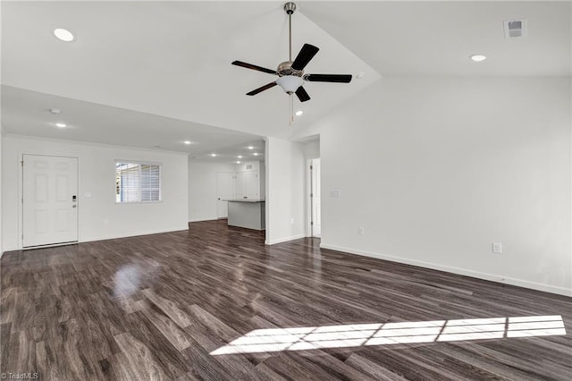 unfurnished living room featuring visible vents, vaulted ceiling, dark wood-type flooring, and recessed lighting