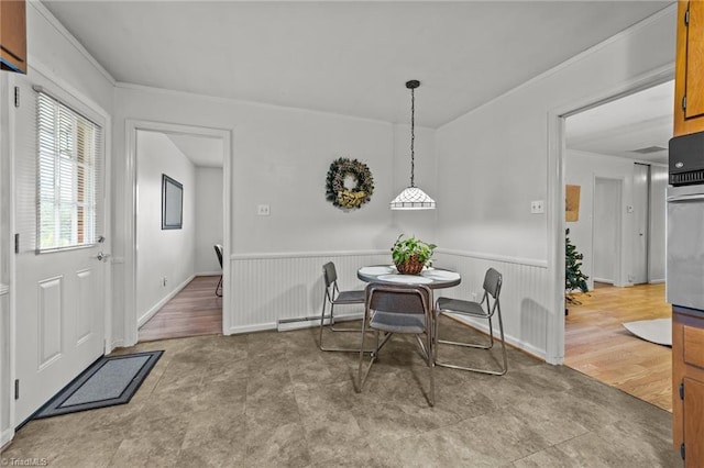 dining room featuring wood-type flooring and baseboard heating