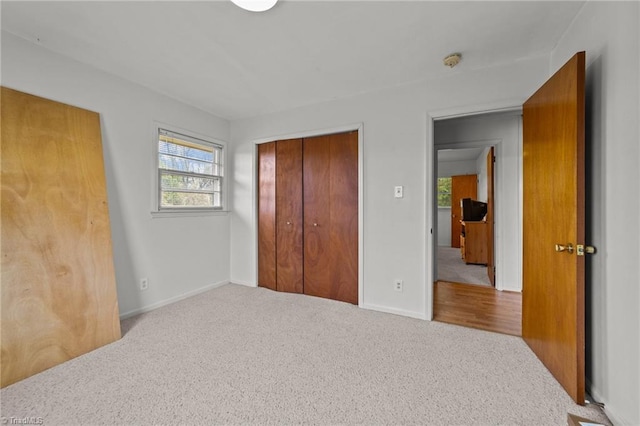 bedroom with a closet and carpet floors