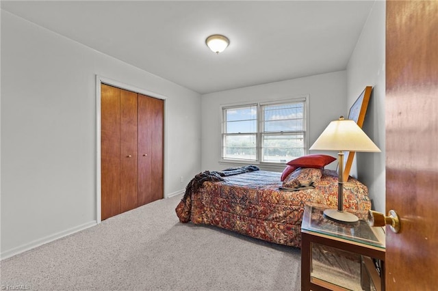 bedroom with carpet flooring and a closet