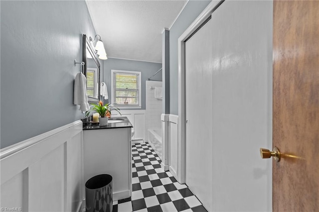 full bathroom featuring bathtub / shower combination, vanity, and toilet