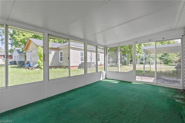 unfurnished sunroom with lofted ceiling