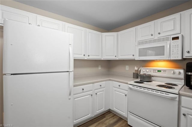 kitchen featuring light countertops, white cabinets, white appliances, and wood finished floors