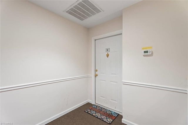 view of exterior entry with visible vents