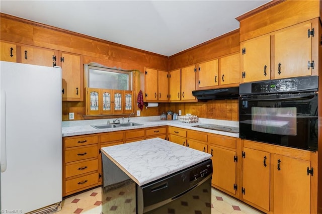 2003 Random Dr, Greensboro, NC 27407 - kitchen with black appliances, light floors, under cabinet range hood, a sink, and light countertops