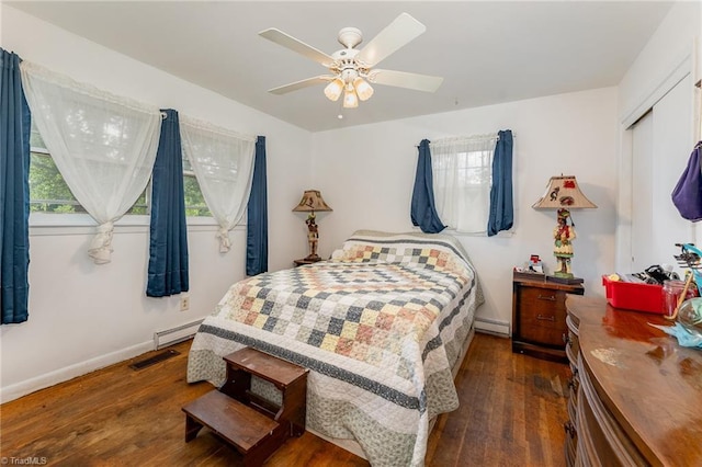 2003 Random Dr, Greensboro, NC 27407 - bedroom with dark wood-style floors, a baseboard radiator, baseboards, and ceiling fan
