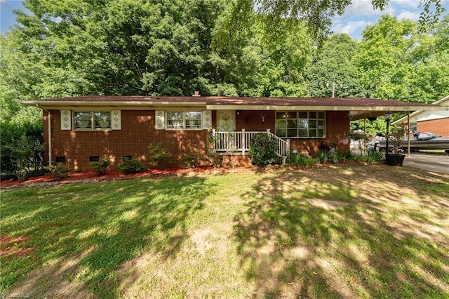 2003 Random Dr, Greensboro, NC 27407 - view of front facade with crawl space, a front lawn, brick siding, and an attached carport