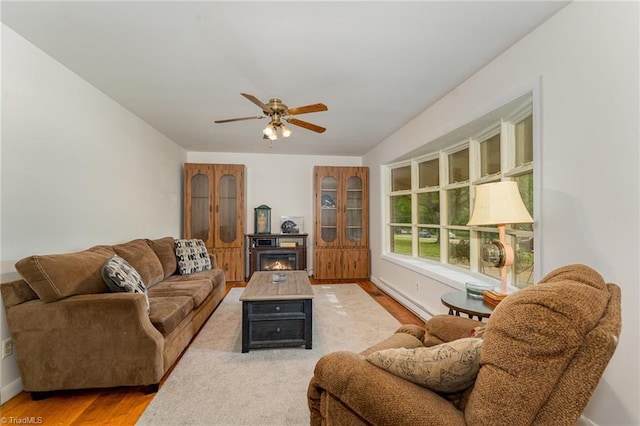 2003 Random Dr, Greensboro, NC 27407 - living room with wood finished floors, a ceiling fan, and baseboards