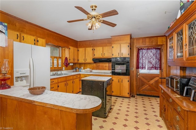 2003 Random Dr, Greensboro, NC 27407 - kitchen with oven, white refrigerator with ice dispenser, under cabinet range hood, light floors, and light countertops