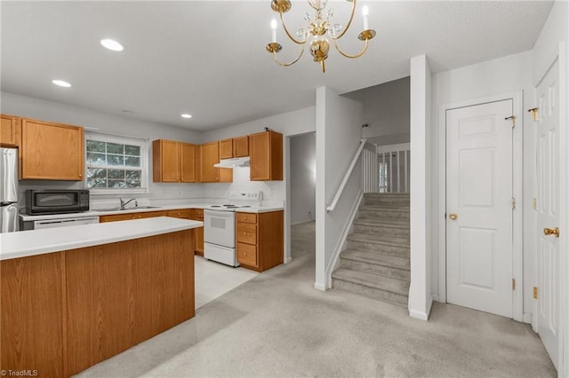 kitchen featuring white appliances, light carpet, sink, hanging light fixtures, and a chandelier