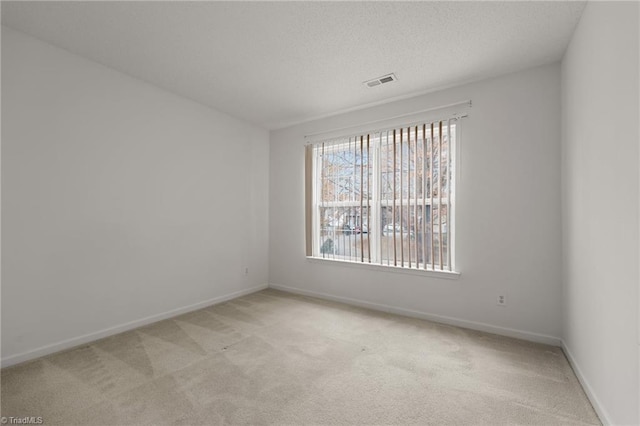 empty room with light colored carpet