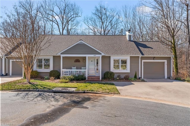 ranch-style house featuring a garage, concrete driveway, covered porch, and roof with shingles