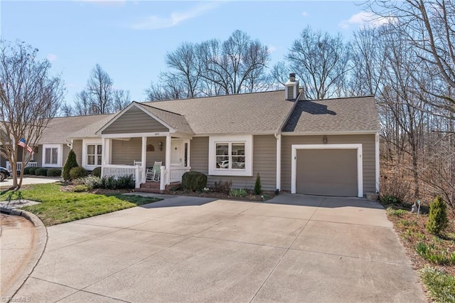 ranch-style house with a garage, concrete driveway, a chimney, roof with shingles, and covered porch