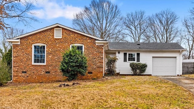 view of front of home featuring a garage and a front lawn