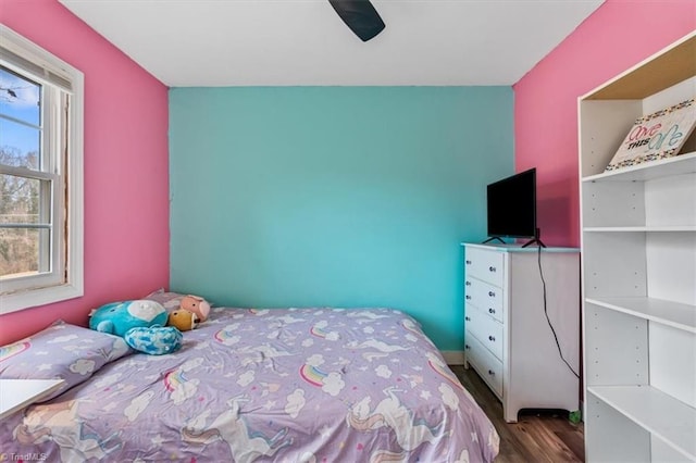 bedroom featuring hardwood / wood-style flooring and ceiling fan