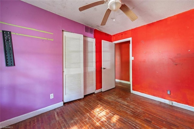1278 Tredwell Dr, Winston-Salem, NC 27103 - unfurnished bedroom featuring wood-type flooring, a closet, and a ceiling fan