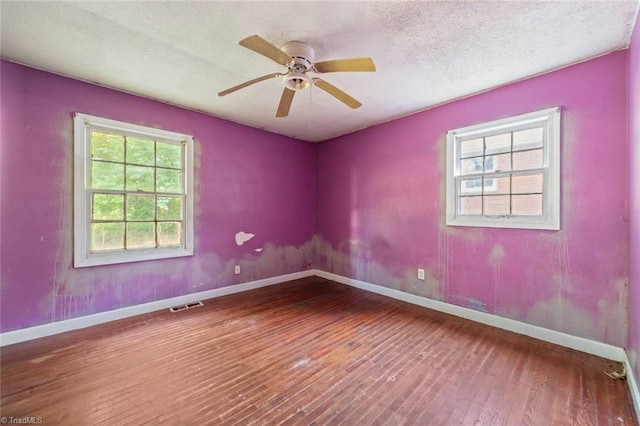 1278 Tredwell Dr, Winston-Salem, NC 27103 - spare room with hardwood / wood-style flooring, a ceiling fan, and a textured ceiling