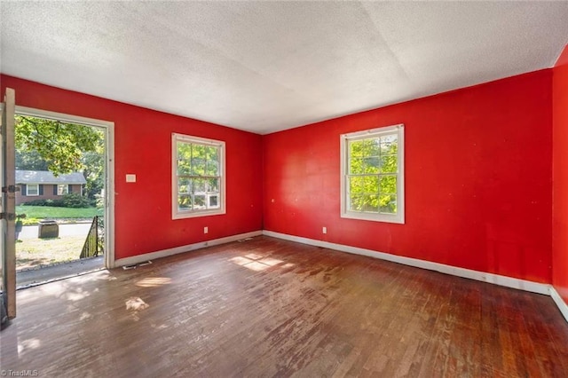 1278 Tredwell Dr, Winston-Salem, NC 27103 - spare room featuring wood finished floors and a textured ceiling