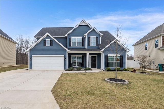 view of front of house with a garage and a front lawn