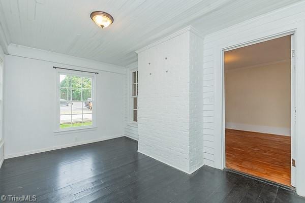 112 S Caldwell St, Salisbury, NC 28144 - empty room featuring dark wood-type flooring, crown molding, and baseboards