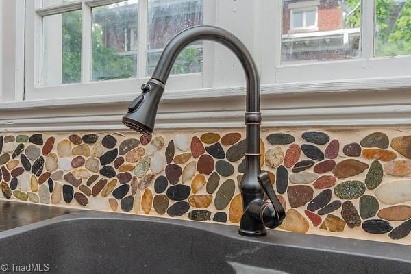 112 S Caldwell St, Salisbury, NC 28144 - kitchen view of a sink and tasteful backsplash