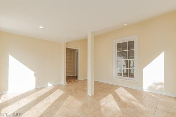 112 S Caldwell St, Salisbury, NC 28144 - empty room with light tile patterned floors, recessed lighting, and baseboards