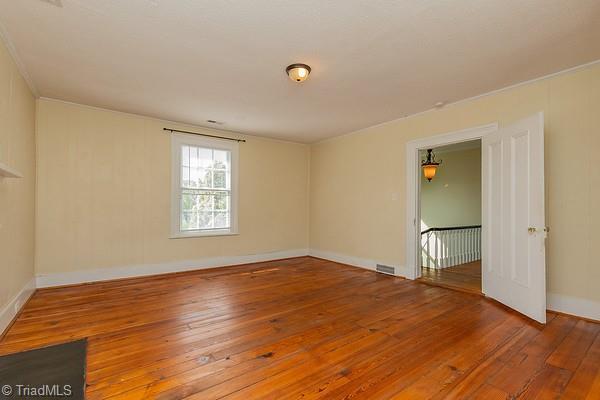 112 S Caldwell St, Salisbury, NC 28144 - spare room with hardwood / wood-style floors and baseboards