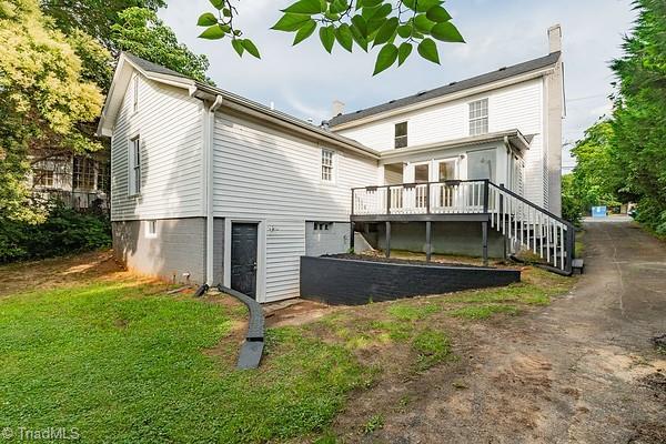 112 S Caldwell St, Salisbury, NC 28144 - back of house featuring a wooden deck and a yard