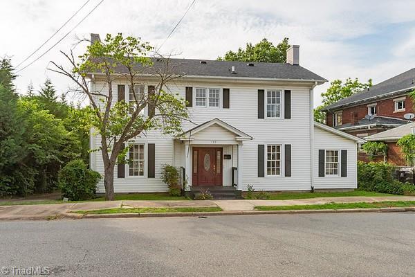 112 S Caldwell St, Salisbury, NC 28144 - colonial-style house with a chimney