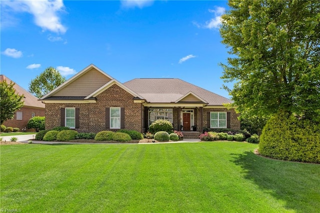 599 Tillie Scott Ct, Greensboro, NC 27455 - view of front of home featuring a front yard and brick siding