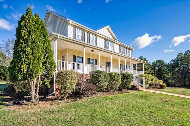 view of front of house featuring a porch and a front lawn