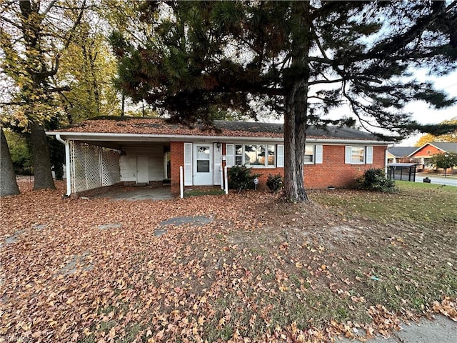 ranch-style house with a carport