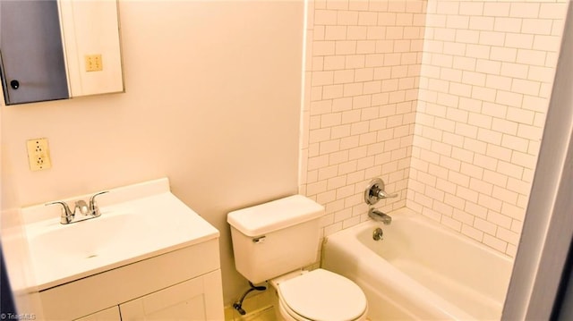 full bathroom featuring vanity, tiled shower / bath combo, and toilet