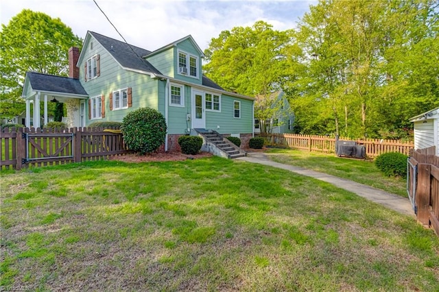 view of front of home featuring fence private yard, a chimney, and a front yard