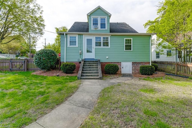 bungalow with a fenced backyard and a front yard