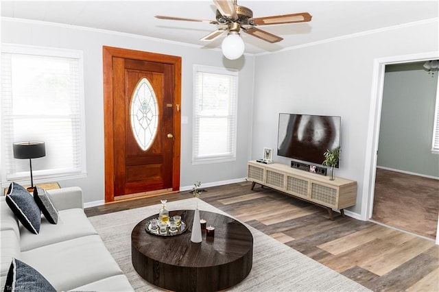 living room featuring crown molding, hardwood / wood-style flooring, and ceiling fan