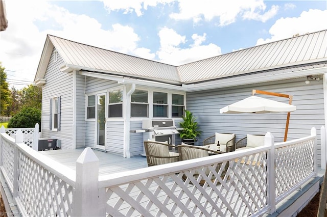 wooden deck with area for grilling