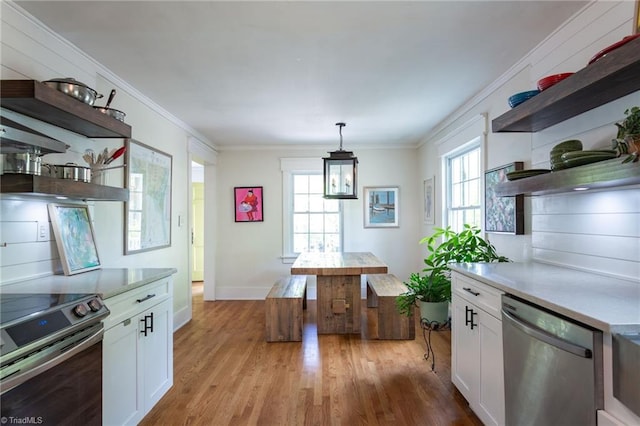 kitchen featuring open shelves, stainless steel appliances, white cabinets, crown molding, and light wood-style floors