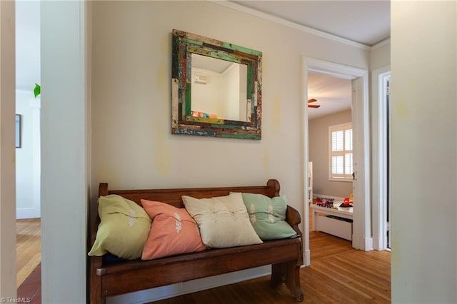 bedroom featuring crown molding and wood finished floors