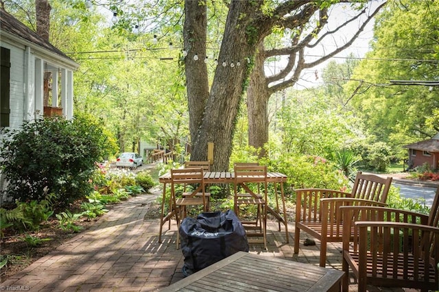 wooden deck with a patio area