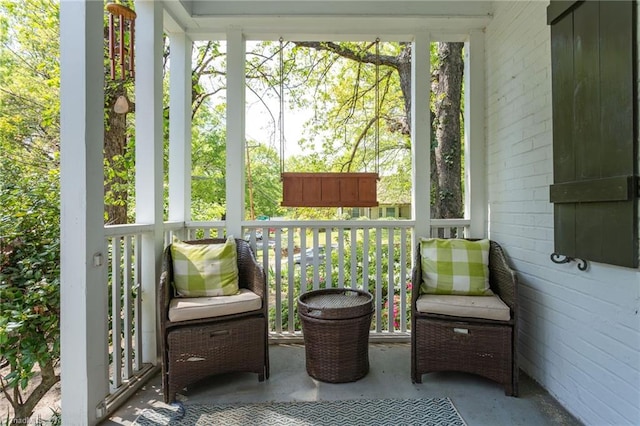 sunroom / solarium featuring healthy amount of natural light