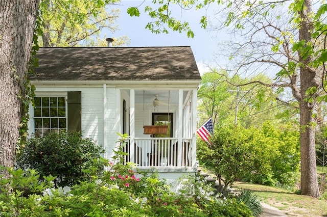 view of outdoor structure featuring covered porch