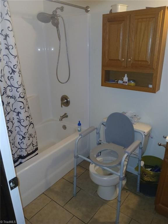 bathroom featuring tile patterned floors, shower / tub combo, and toilet