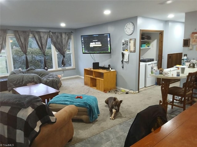 living room featuring carpet flooring and independent washer and dryer