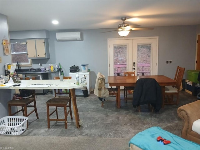 dining room with a wall mounted air conditioner, french doors, and ceiling fan