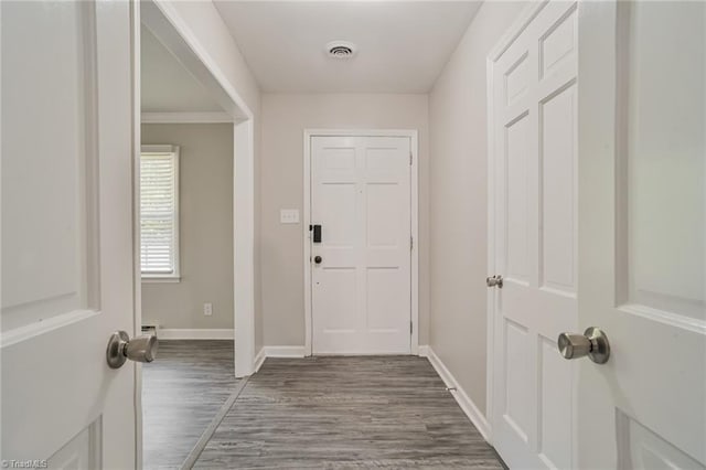 doorway with dark hardwood / wood-style floors