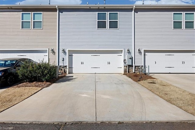 exterior space with concrete driveway