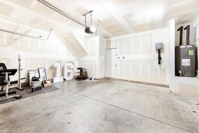 garage with water heater and a garage door opener