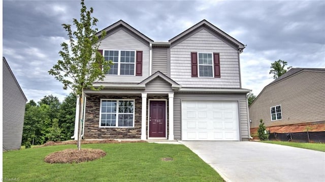 view of front of home featuring a garage and a front yard