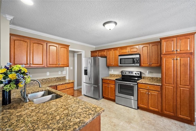 269 Country Villa Dr, Lexington, NC 27295 - kitchen featuring stainless steel appliances, a sink, crown molding, dark stone countertops, and brown cabinets